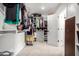 Spacious walk-in closet with built-in shelving and ample storage space for clothes and accessories at 17652 W Straight Arrow Ln, Surprise, AZ 85387