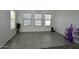 An empty room is filled with bright light and a 'bon appetit' wall decoration at 17829 W Sherman St, Goodyear, AZ 85338