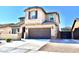 Beautiful home featuring a two-car garage, tile roof, and desert landscaping at 17829 W Sherman St, Goodyear, AZ 85338