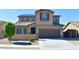 Inviting home features a two-car garage, desert landscaping, and solar panels at 17829 W Sherman St, Goodyear, AZ 85338