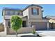 Charming home featuring desert landscaping, a two-car garage, and a tiled roof at 17829 W Sherman St, Goodyear, AZ 85338
