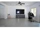 Spacious living room with tile floors and lots of natural light at 17829 W Sherman St, Goodyear, AZ 85338