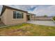 Expansive backyard with lush lawn, covered patio, and privacy fencing, creating a serene outdoor retreat at 18766 W Montebello Ave, Litchfield Park, AZ 85340