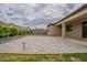 Large paved backyard with lush greenery, offering a perfect space for outdoor activities and relaxation at 18766 W Montebello Ave, Litchfield Park, AZ 85340
