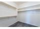 Walk-in closet with neutral walls and shelving for storage at 18766 W Montebello Ave, Litchfield Park, AZ 85340