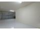 Bright and clean garage featuring sealed flooring and ample space for storage at 18766 W Montebello Ave, Litchfield Park, AZ 85340