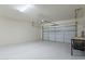 A spacious garage with epoxy floors and an automatic door, perfect for parking and storage at 18766 W Montebello Ave, Litchfield Park, AZ 85340