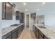 Well-equipped kitchen with granite countertops, stainless steel appliances, and ample cabinet space at 18766 W Montebello Ave, Litchfield Park, AZ 85340