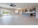 Open concept living space, flowing into the kitchen, with sliding glass door access to the backyard at 18766 W Montebello Ave, Litchfield Park, AZ 85340