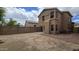 Spacious backyard with a brick wall and a small patio area at 1909 N 106Th Ave, Avondale, AZ 85392