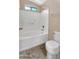 Bright bathroom showcasing a tub/shower combo with white tile surround at 1909 N 106Th Ave, Avondale, AZ 85392