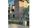 Exterior view of a brick condo building with balconies, green space, and community amenities at 200 E Southern Ave # 133, Tempe, AZ 85282