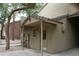 View of the exterior of a condo building with a covered entryway and neutral-colored siding at 200 E Southern Ave # 133, Tempe, AZ 85282