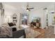 Bright living room with hardwood floors, a ceiling fan, and access to a balcony at 200 E Southern Ave # 133, Tempe, AZ 85282