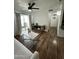 Bright living room with sliding door to the balcony, ceiling fan, and modern furnishings at 200 E Southern Ave # 133, Tempe, AZ 85282
