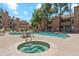 Community pool features a lounge-chair-surrounded pool, hot tub, seating and lush landscaping, creating a retreat at 200 E Southern Ave # 133, Tempe, AZ 85282