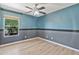 Well-lit bedroom with ceiling fan, window, and neutral paint scheme at 2418 W White Feather Ln, Phoenix, AZ 85085