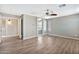 Spacious bedroom featuring hardwood floors and a view into an en suite bathroom at 2418 W White Feather Ln, Phoenix, AZ 85085