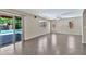 View of the living room with sliding doors leading to the pool area, enhancing indoor-outdoor living at 2418 W White Feather Ln, Phoenix, AZ 85085