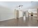 Spacious living room featuring tile flooring, neutral walls, ample lighting, and an open layout at 2418 W White Feather Ln, Phoenix, AZ 85085