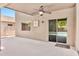 Covered patio with ceiling fan, tile flooring and access to the pool, creates the perfect outdoor entertaining space at 2418 W White Feather Ln, Phoenix, AZ 85085
