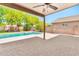 Open patio showcases the pool and outdoor space, complete with mature landscaping and privacy walls at 2418 W White Feather Ln, Phoenix, AZ 85085