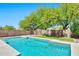 Enjoy this gorgeous pool, framed by mature trees and a cozy pergola, perfect for outdoor relaxation at 2418 W White Feather Ln, Phoenix, AZ 85085