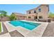 Enjoy the backyard's large pool in a beautifully landscaped and private backyard setting at 2418 W White Feather Ln, Phoenix, AZ 85085