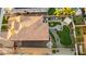 Beautiful aerial view of the home and manicured backyard with an outdoor kitchen, rock garden, and putting green at 26065 N 74Th Dr, Peoria, AZ 85383