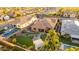 Lovely home with an expansive backyard featuring turf, a rock garden, a fire pit area, and mature landscaping at 26065 N 74Th Dr, Peoria, AZ 85383