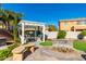 Charming backyard featuring a stone bench, inviting pergola, and landscaped area at 26065 N 74Th Dr, Peoria, AZ 85383