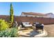Cozy backyard patio with comfortable seating around a small fountain, perfect for outdoor relaxation at 26065 N 74Th Dr, Peoria, AZ 85383