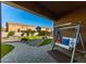 Lush backyard featuring an outdoor swing, patio and artificial turf at 26065 N 74Th Dr, Peoria, AZ 85383