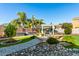 Stunning backyard featuring a lush lawn, a built-in grill area, and a white pergola with shaded seating at 26065 N 74Th Dr, Peoria, AZ 85383