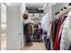 A walk-in closet is organized with shelving and a ladder for reaching high shelves at 26065 N 74Th Dr, Peoria, AZ 85383