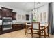 Charming dining area with modern cabinetry, stylish lighting and bright natural light at 26065 N 74Th Dr, Peoria, AZ 85383