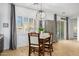Elegant dining area featuring an eye-catching chandelier, neutral colors, and view to a covered patio at 26065 N 74Th Dr, Peoria, AZ 85383