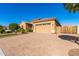 Expansive driveway leads to the garage of this beautifully maintained home at 26065 N 74Th Dr, Peoria, AZ 85383