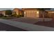 Attractive single-Gathering home boasting a brick driveway, a two-car garage, and manicured landscaping at 26065 N 74Th Dr, Peoria, AZ 85383