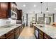 Spacious kitchen featuring granite countertops, stainless steel appliances, and a breakfast nook at 26065 N 74Th Dr, Peoria, AZ 85383