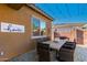 Inviting outdoor patio with stylish furniture and charming string lights for comfortable outdoor living at 26065 N 74Th Dr, Peoria, AZ 85383