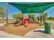 Neighborhood playground featuring a shade structure, slides and climbing area on a wood chip surface at 26065 N 74Th Dr, Peoria, AZ 85383