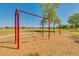 Playground with swings, mature shade trees and green grass at 26065 N 74Th Dr, Peoria, AZ 85383