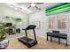 Home gym featuring a treadmill, piano, and a motivational whiteboard at 26065 N 74Th Dr, Peoria, AZ 85383
