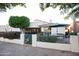 Tranquil backyard with patio furniture, verdant lawn, and mature trees at 2635 N 62Nd St, Mesa, AZ 85215