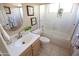 Bright bathroom boasts a tub/shower combination and a vanity with plentiful counter space at 2635 N 62Nd St, Mesa, AZ 85215