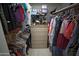 Walk-in closet with custom shelves and plenty of hanging space at 2635 N 62Nd St, Mesa, AZ 85215