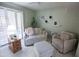 Inviting living room featuring a comfortable sofa, accent chair, and charming decor at 2635 N 62Nd St, Mesa, AZ 85215