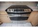 Modern stainless steel stove and oven with digital controls and light wood cabinetry at 2635 N 62Nd St, Mesa, AZ 85215