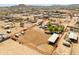 Expansive aerial view of horse property with large lot, arena, barn and mature trees at 28061 N Holly Rd, San Tan Valley, AZ 85143